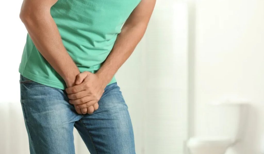 man feeling hurt at his bottom