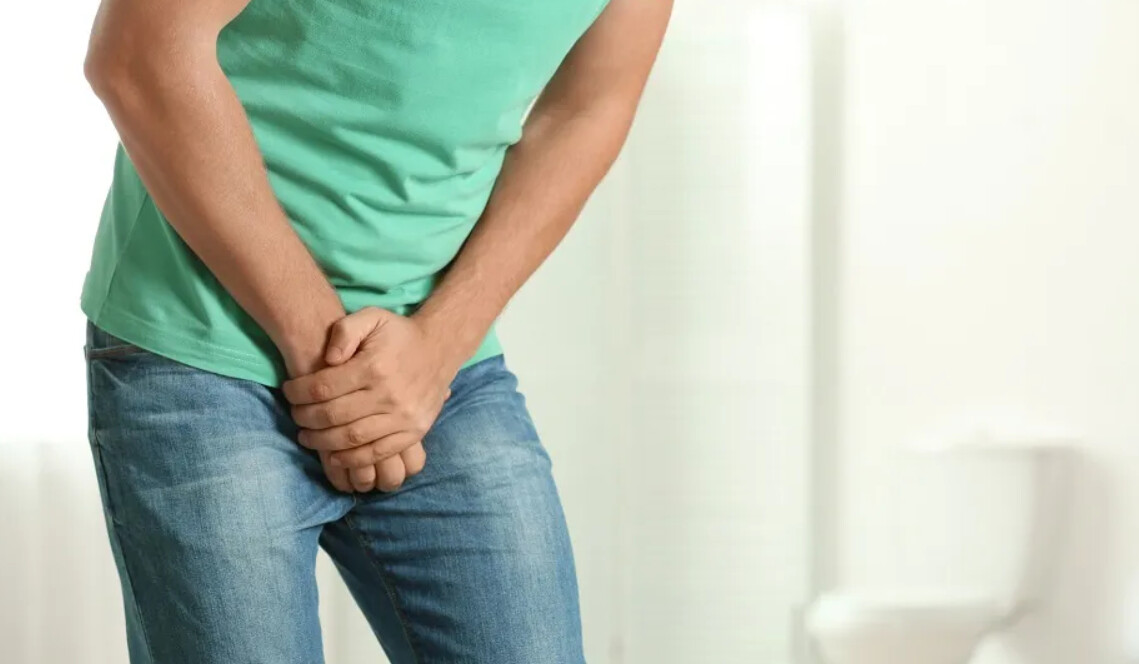 man feeling hurt at his bottom