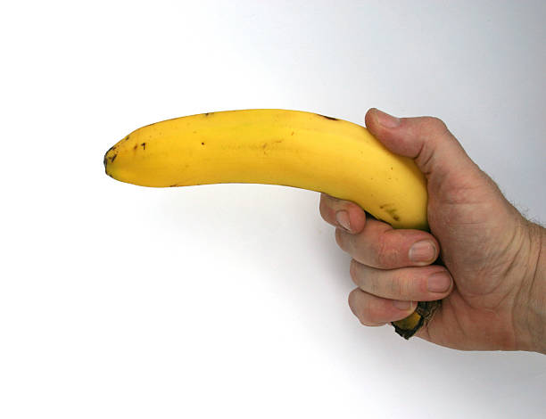man holding a banana