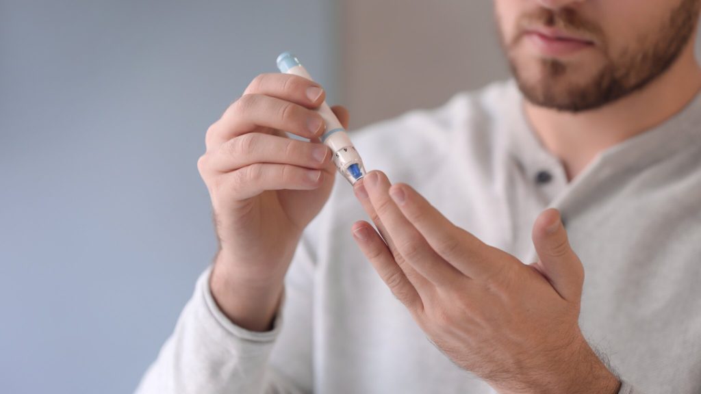 man with a diabetes prick
